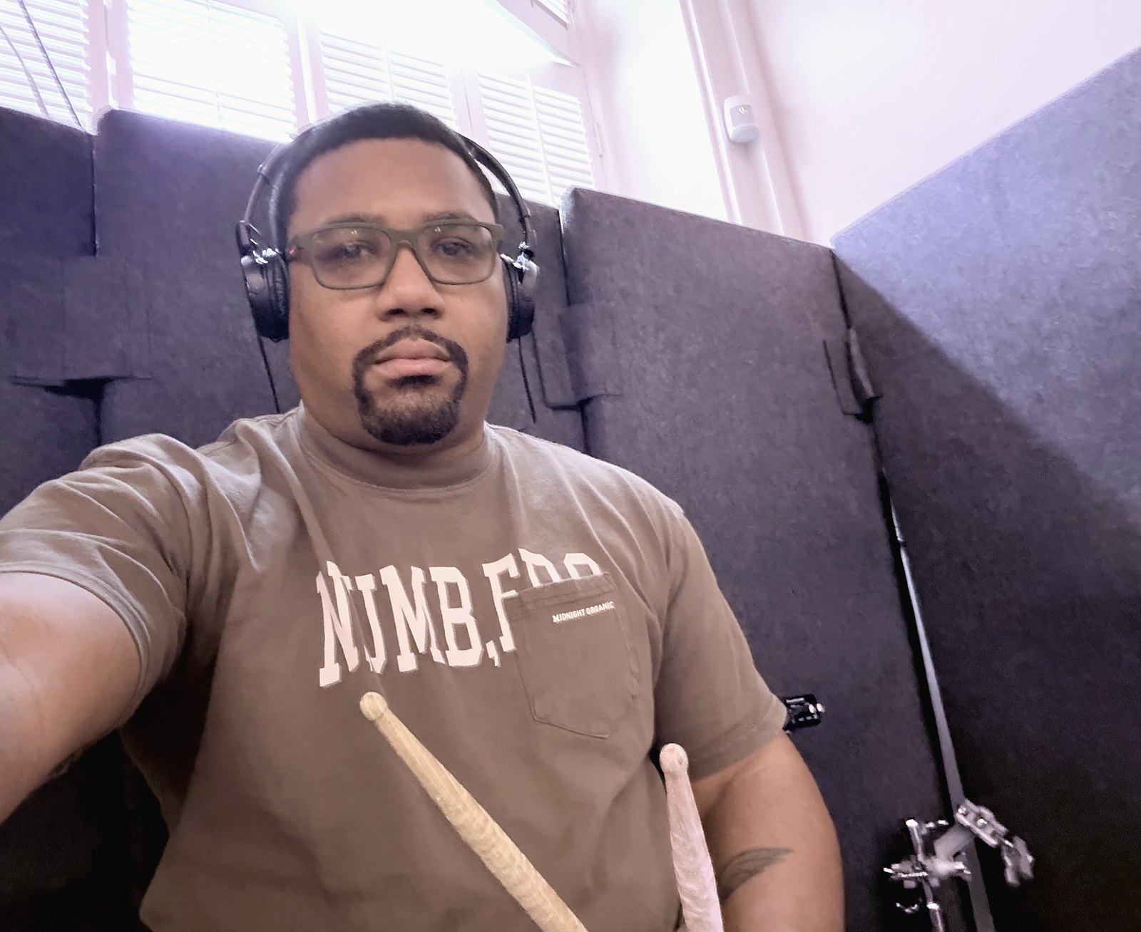 Dante Harris in the room, sticks and headphones